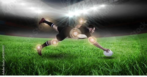 Multiple round scanners over caucasian male rugby player holding a rugby ball diving against stadium