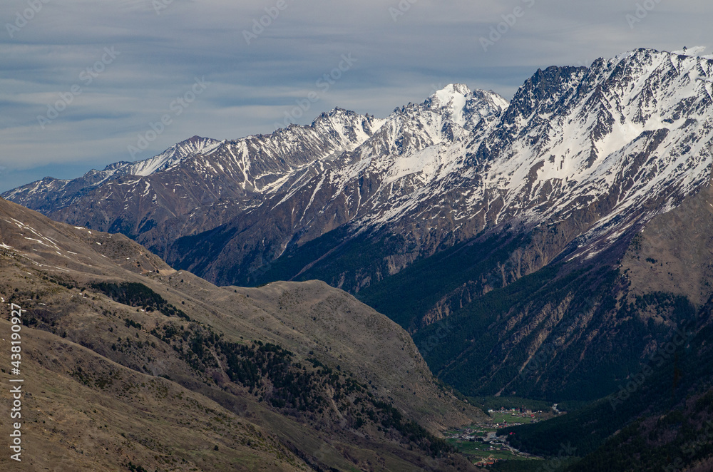 Panorama of a beautiful mountain landscape in the Elbrus region of Kabardino-Balkaria. Mountains in the snow Panorama of a beautiful mountain landscape in the Elbrus region of Kabardino-Balkaria. Mountains in the snow