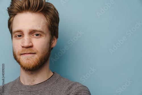 White ginger man with beard posing and looking at camera