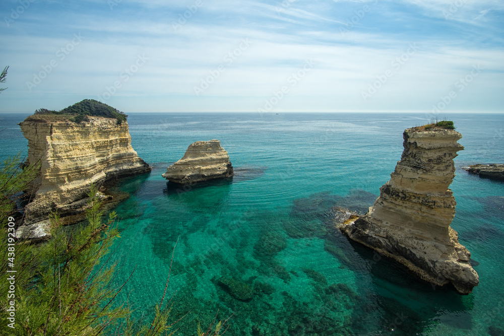 Naklejka premium Torre dell'Orso, with its high cliffs and blue sea, in Salento, Puglia, Italy