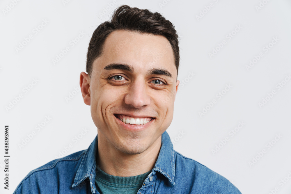 Young brunette man smiling and looking at camera Young brunette man smiling and looking at camera