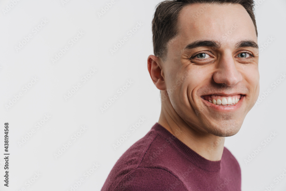 Young brunette man smiling and looking at camera Young brunette man smiling and looking at camera