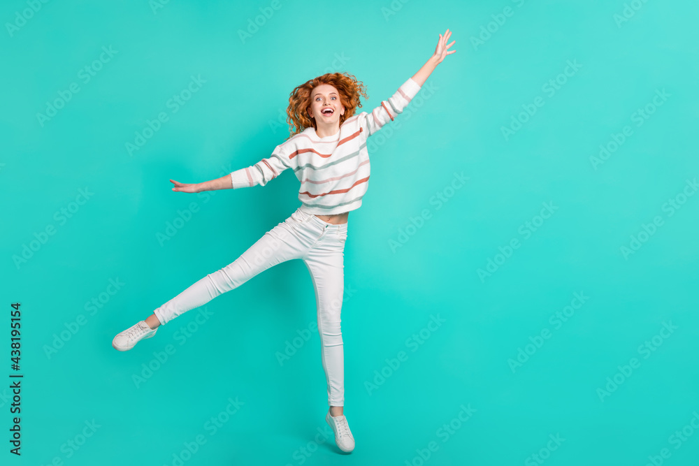 Obraz premium Full length body size view of pretty funny girlish cheery wavy-haired girl jumping fooling isolated over bright teal turquoise color background