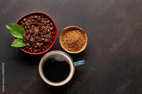 Roasted coffee beans, ground powder and cup