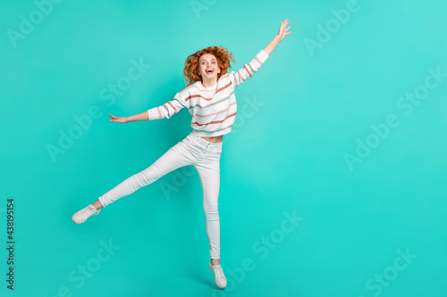 Fototapeta Naklejka Na Ścianę i Meble -  Full length body size view of pretty funny girlish cheery wavy-haired girl jumping fooling isolated over bright teal turquoise color background