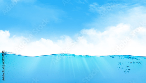 Waterline with sea underwater and blue sunny sky photo