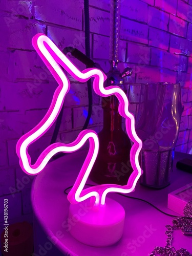 graffiti on wall. neon. neon unicorn.