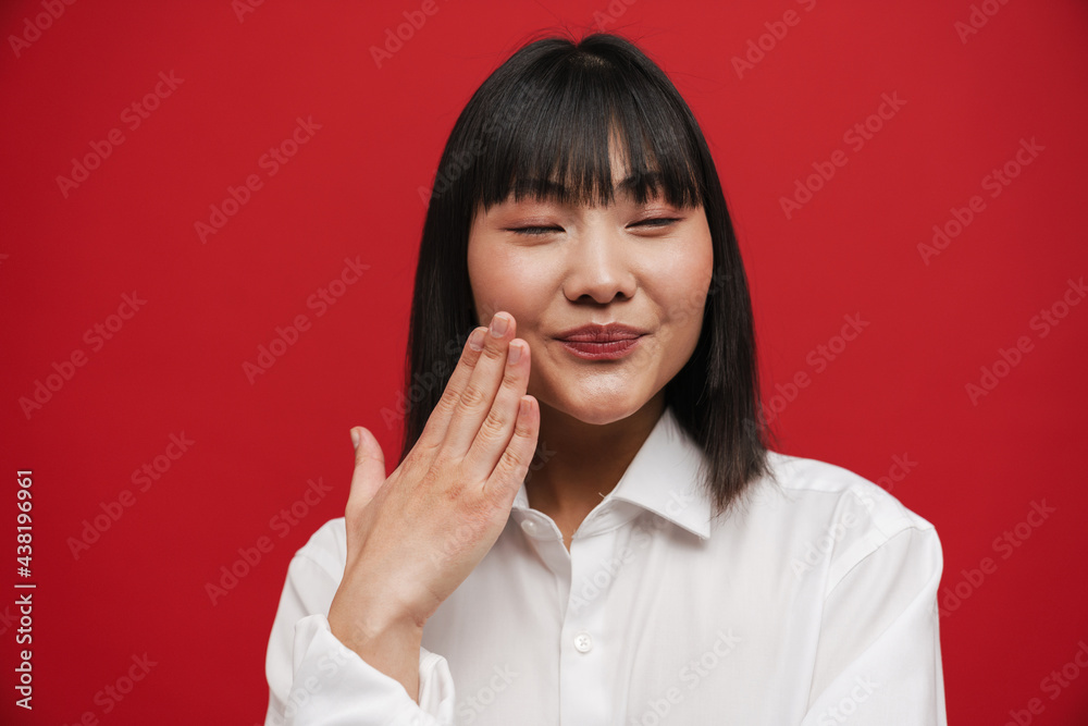 Young asian woman wearing shirt smiling and gesturing Young asian woman wearing shirt smiling and gesturing