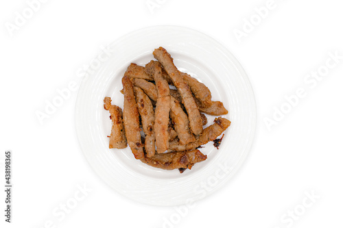 Top view of fried crispy pork belly cooked with pepper and garlic on modern ceramic dish isolated on white backgound with clipping path.