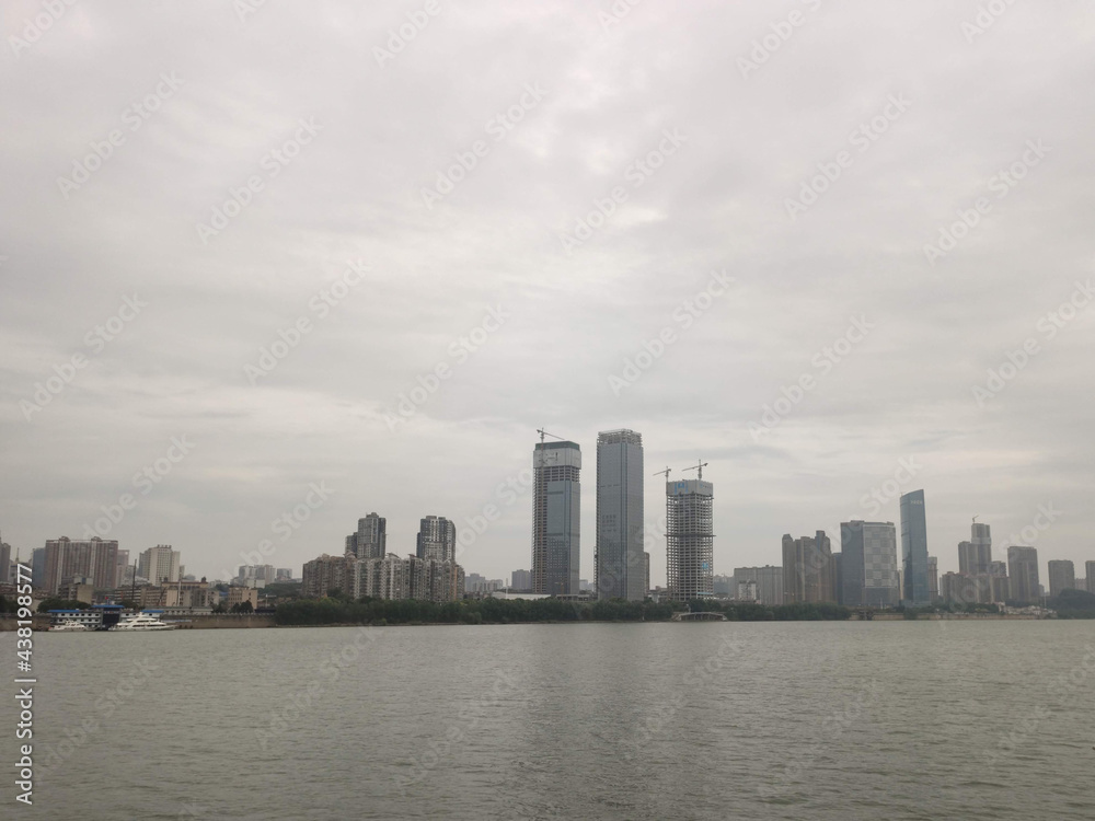 View of the Modern skyscrapers on the shore of Xiang River. Skyline view. Business district. CBD, downtown. Changsha. Hunan. China. Asia