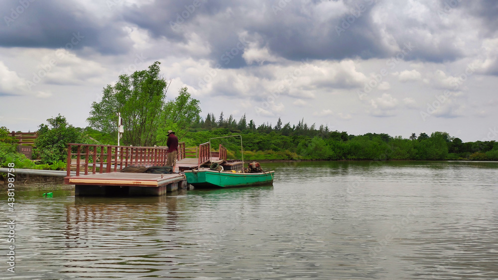 Boat on the river. Dongzhai Harbor National Nature Reserve. Small river near the mangrove. Haikou, Hainan Island, China. Asia