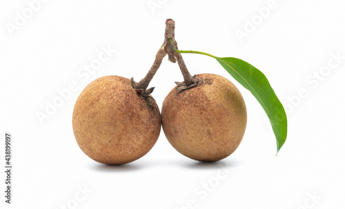 Fresh sapodilla plums with leaf isolated on white background. photo