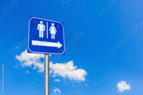 restroom. toilet sign on blue sky background.