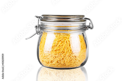 pasta in a glass jar on a white background isolated