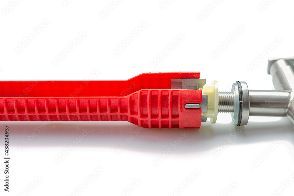 Red pipe wrench isolated on white background