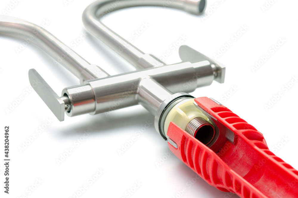 Red pipe wrench isolated on white background Red pipe wrench isolated on white background