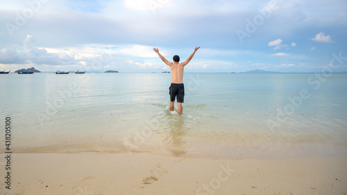 happy man enjoying and relaxing on the beach, Summer and holidays concept