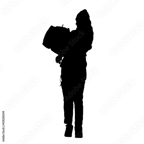 Silhouette of a young female posing for the camera. 