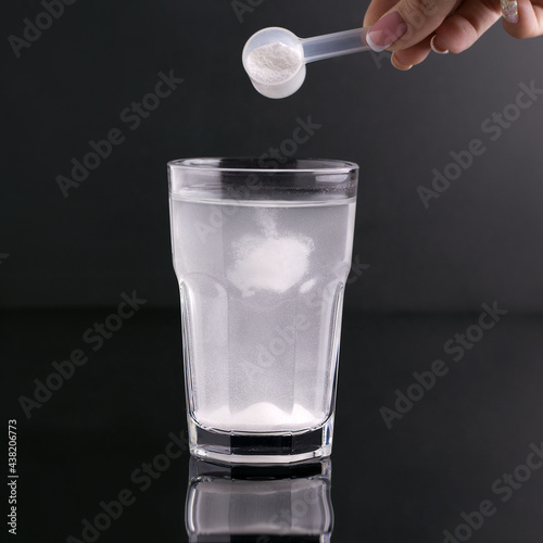 Fitness drink in a glass on a black background