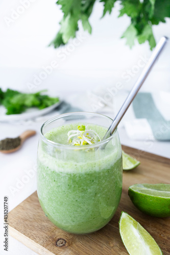 Fresh green fruit and vegetable smoothie. Detox smoothie with spinach and celery. Healthy diet. Vegetarian and vegan diet.