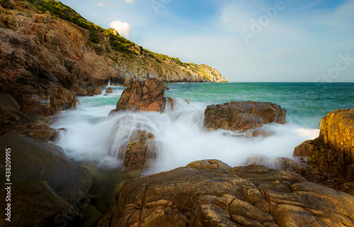 Rocky beach with big waves in Ninh Thuan province, Vietnam.