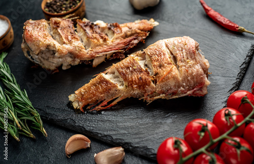 grilled red sea bass on stone background