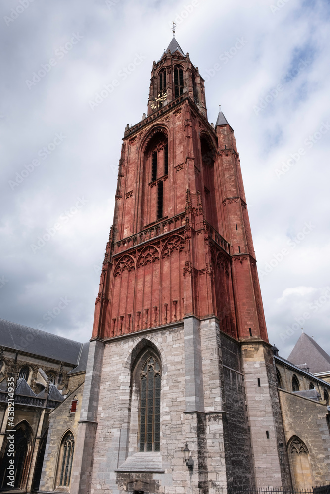 Red tower with church building of the St. John's Church or Sint-Janskerk (Sint Jan) rises from the Vrijthof square in Maastricht, the Netherlands Red tower with church building of the St. John's Church or Sint-Janskerk (Sint Jan) rises from the Vrijthof square in Maastricht, the Netherlands