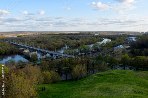 View of a flat area with a river and a bridge over the river on a spring day. A panorama that opens from the observation deck in the city of Vladimir in Russia.