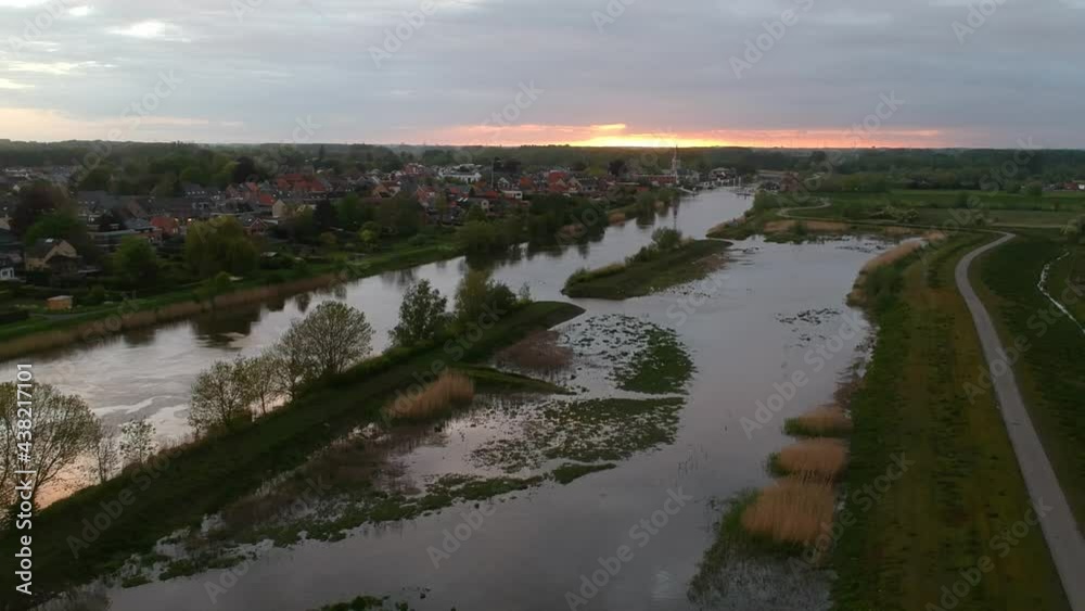 Panoramic aerial view of swamp and houses in background at sunset Panoramic aerial view of swamp and houses in background at sunset