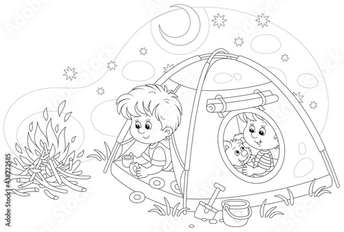 Cheerful little kids tourists with a merry pup resting in their camp tent on a starry night on summer vacation, black and white outline vector cartoon illustration for a coloring book page