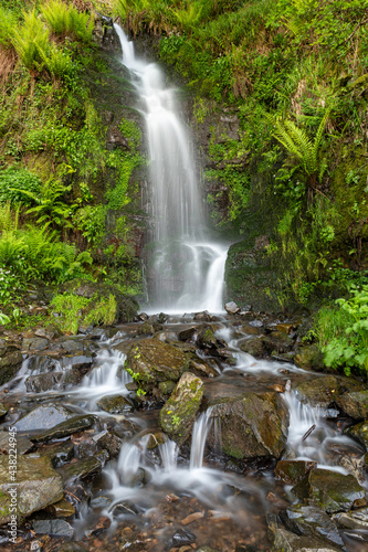 Long exposure of the Hollowbrook waterfall on the South West Coastpath from Woody Bay to Heddons Mouth in Devon