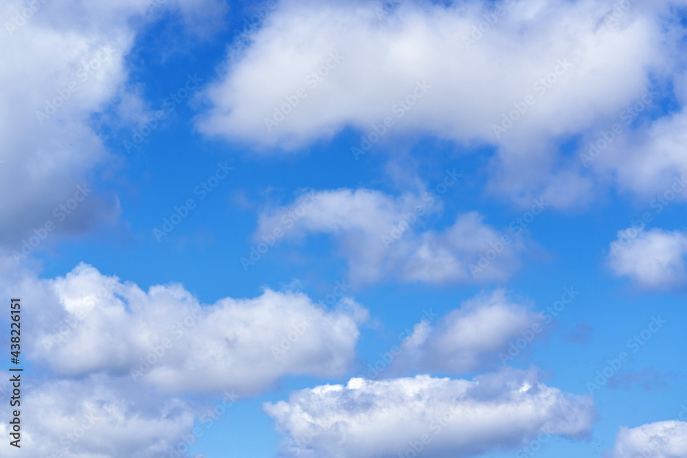 White cumulus clouds on blue sky background, natural phenomenon White cumulus clouds on blue sky background, natural phenomenon