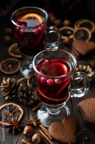Glass with mulled wine and spices, selective focus