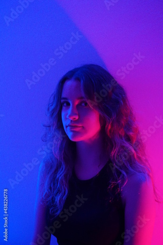 teenager in blue with neon ights