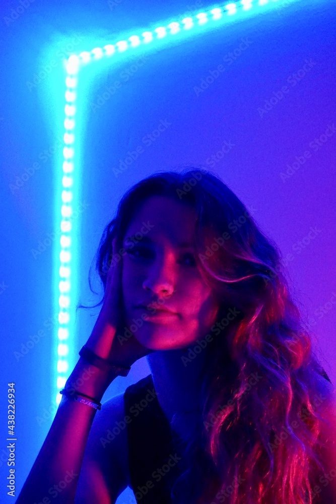 teenager in blue with neon ights teenager in blue with neon ights