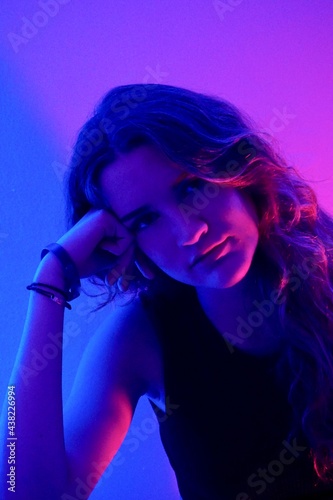 teenager in blue with neon ights