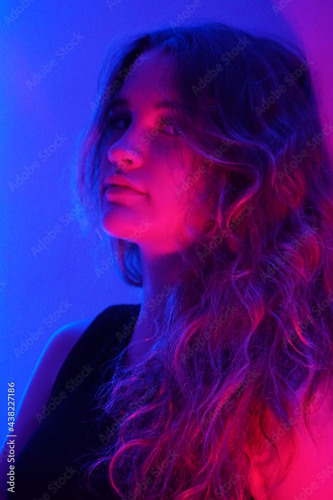 teenager in blue with neon ights