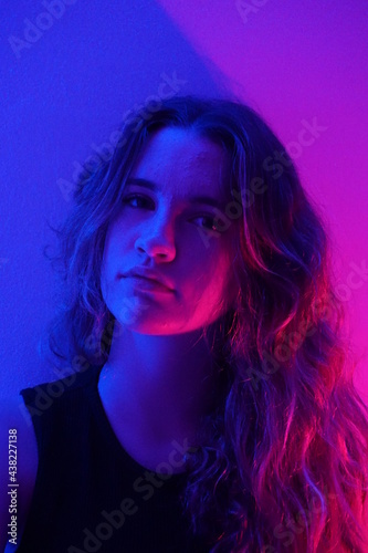 teenager in blue with neon ights