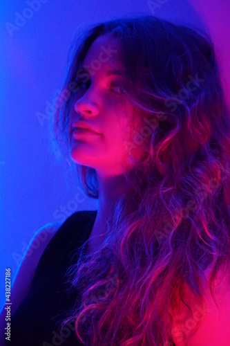 teenager in blue with neon ights