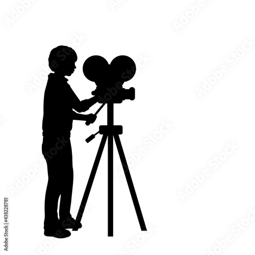 Silhouette boy with film projector. filming with camcorder