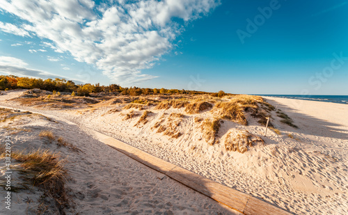 Amazing white sand beach in Sandhammaren, Sweden. Popular tourist destination in summer season. photo