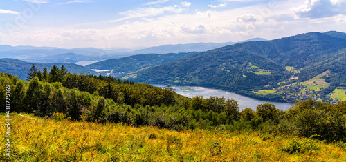 Panoramic view of Beskidy Mountains surrounding Zywieckie and Miedzybrodzkie Lake seen from Gora Zar mountain near Zywiec in Silesia region of Poland