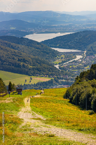 Fototapeta Naklejka Na Ścianę i Meble -  Panoramic view of Beskidy Mountains surrounding Zywieckie and Miedzybrodzkie Lake seen from Gora Zar mountain near Zywiec in Silesia region of Poland