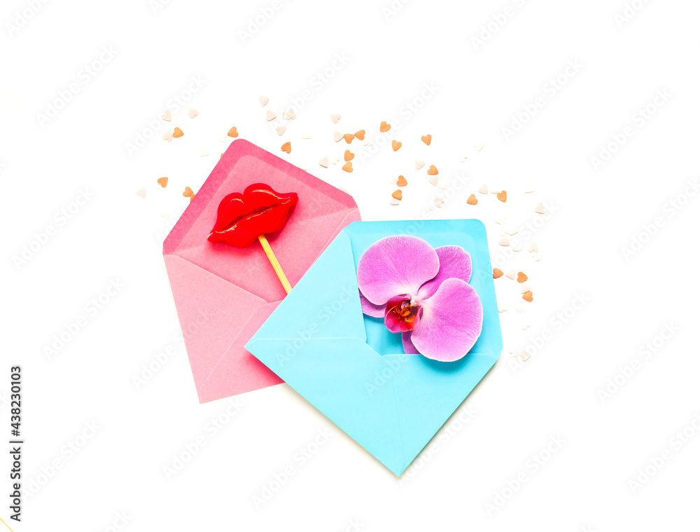 Pink and blue envelopes with decorative lips on stick. Festive concept or Romantic Love message. Creative copy space