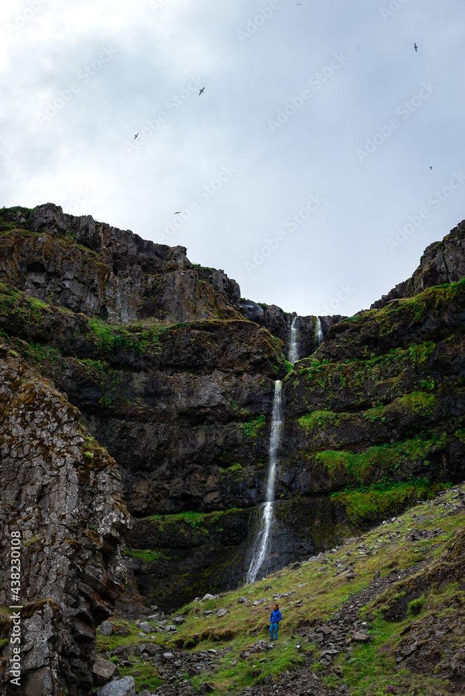 waterfall in the mountains in Iceland waterfall in the mountains in Iceland