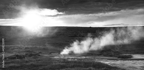 Gazer smoke over a stream in Iceland during sunset