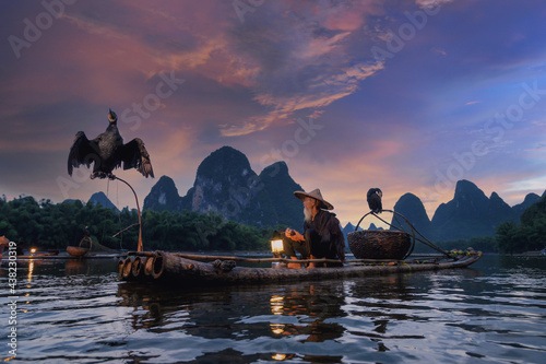 Cormorant fisherman on the Li River, Guilin, Yangshuo, China photo