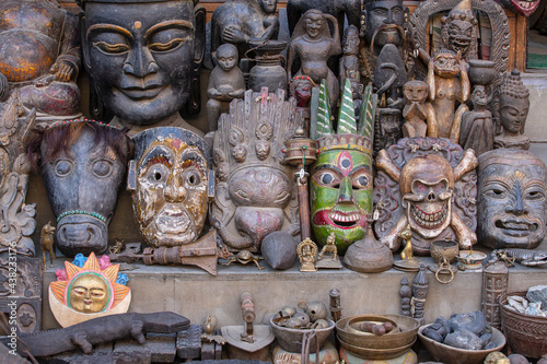Souvenir wooden masks on nepalese street market in Kathmandu, Nepal
