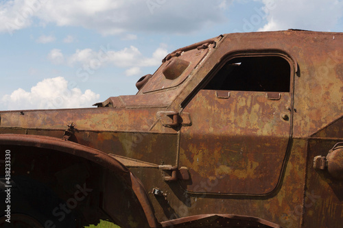 The skeleton of an old ruined armored car in a war zone 