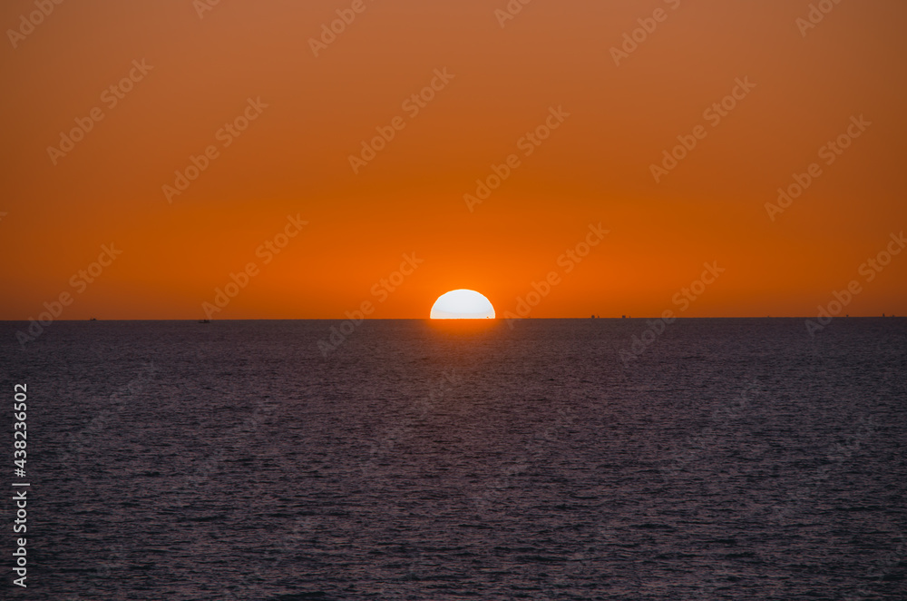 Beautiful sunset on the sea with soft focus and noise.